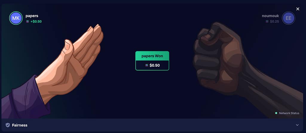 Duel Casino Rock Paper Scissors game result screen showing player "papers" winning $0.50 against opponent "noumouk" with an open hand (paper) beating a fist (rock)