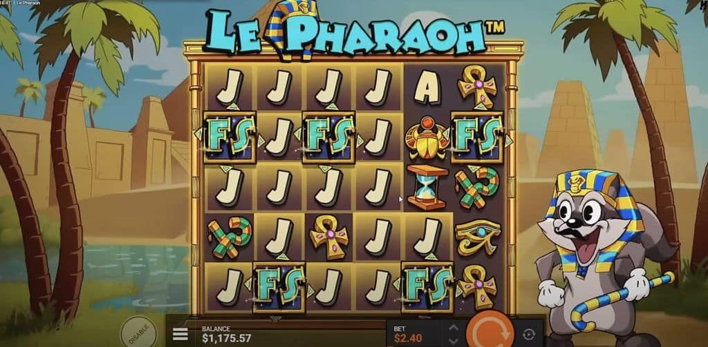Le Pharaoh slot base game showing five FS scatter symbols on the grid with raccoon character in pharaoh costume