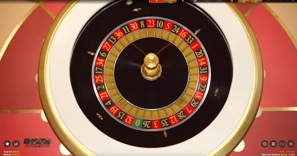 Overhead view of the Red Door Roulette wheel by Evolution Gaming, showing the single-zero European roulette layout with numbered red and black pockets