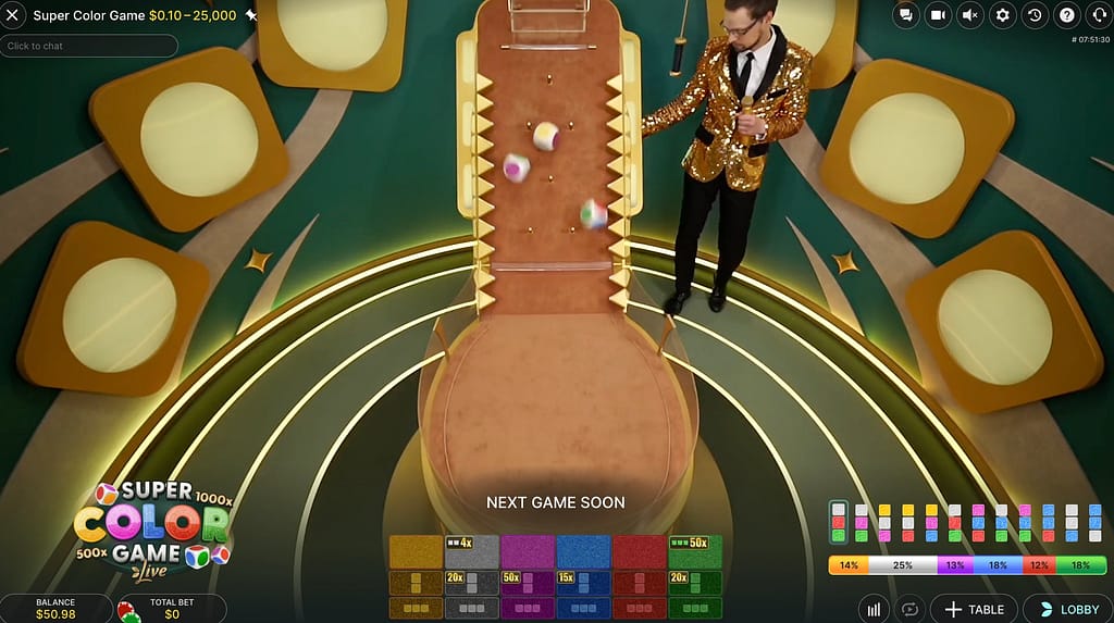 Three multicoloured dice rolling down the pin board in Evolution's Super Color Game live casino, with the host in a gold sequin jacket and the betting grid showing multipliers up to 50x