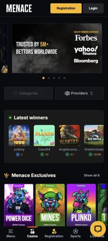 Menace Casino mobile homepage showing Forbes Yahoo Finance and Bloomberg media features, latest winners section, and Ebaka Games exclusives including Power Dice, Mines, and Plinko