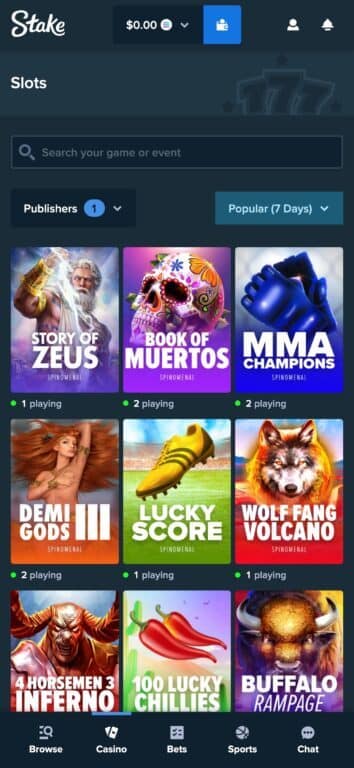 Stake casino's Spinomenal Gaming section showing exclusive slots including Story of Zeus, Book of Muertos, MMA Champions, Wolf Fang Volcano, and other Spinomenal titles with live player counts