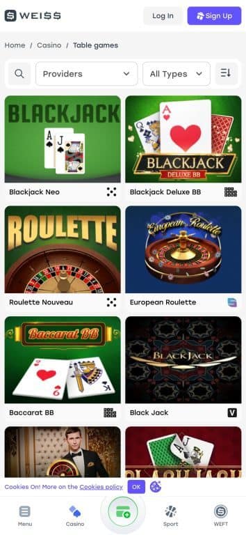 Weiss Casino table games section displaying classic casino games including Blackjack Neo, Blackjack Deluxe BB, Roulette Nouveau, European Roulette, Baccarat BB, and Black Jack with provider filtering options