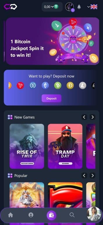 Crypto-Games.io mobile casino homepage showing 1 Bitcoin jackpot wheel promotion, new games section with Rise of Ymir and Tramp Day slots, cryptocurrency deposit options including Bitcoin, Ethereum, Tether, and navigation menu