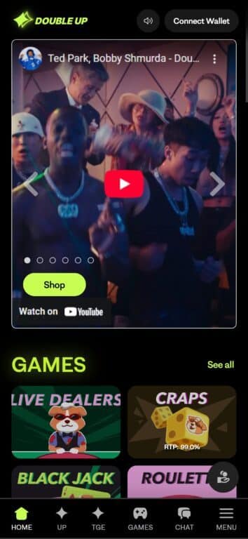 DoubleUp casino mobile homepage showing Ted Park and Bobby Shmurda music video player above game selection tiles for Live Dealers, Craps, Blackjack and Roulette