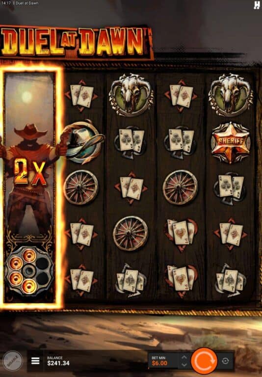 Duel at Dawn gameplay showing an expanded wild reel with 2x multiplier on the first column, featuring western symbols including cowboy characters, sheriff badges, playing cards, wagon wheels, and revolver cylinders